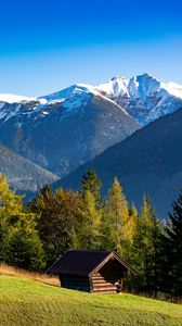 Preview wallpaper building, slope, trees, mountains, snow, nature