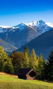 Preview wallpaper building, slope, trees, mountains, snow, nature