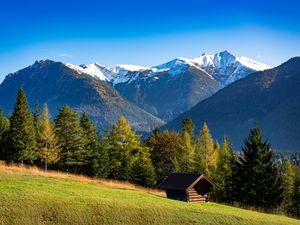 Preview wallpaper building, slope, trees, mountains, snow, nature