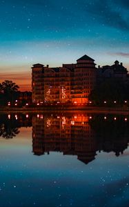 Preview wallpaper building, starry sky, architecture, sunset, reflection
