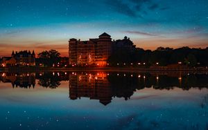 Preview wallpaper building, starry sky, architecture, sunset, reflection