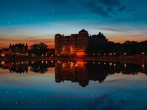 Preview wallpaper building, starry sky, architecture, sunset, reflection