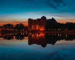 Preview wallpaper building, starry sky, architecture, sunset, reflection