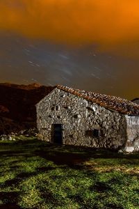 Preview wallpaper building, structure, grass, sky, night