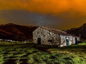 Preview wallpaper building, structure, grass, sky, night