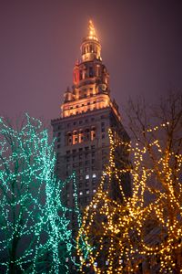 Preview wallpaper building, tower, architecture, trees, garlands, dark