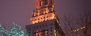 Preview wallpaper building, tower, architecture, trees, garlands, dark