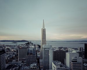 Preview wallpaper building, tower, city, roofs