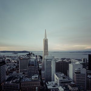 Preview wallpaper building, tower, city, roofs