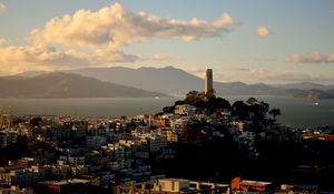 Preview wallpaper building, tower, city, mountains, sea