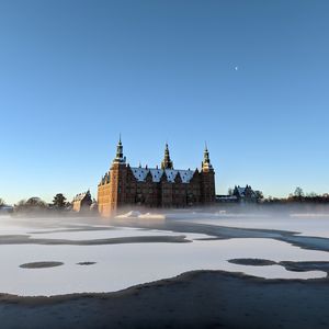 Preview wallpaper building, towers, architecture, fog, water