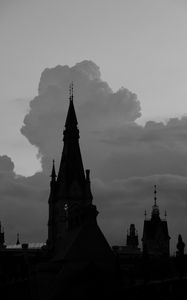 Preview wallpaper building, towers, silhouettes, clouds, evening