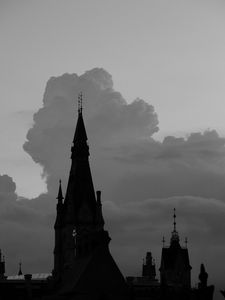 Preview wallpaper building, towers, silhouettes, clouds, evening