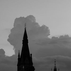 Preview wallpaper building, towers, silhouettes, clouds, evening