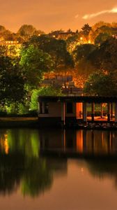 Preview wallpaper building, trees, landscape, night, lights, river