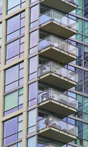 Preview wallpaper building, windows, balconies, flowers, plants