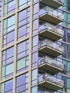 Preview wallpaper building, windows, balconies, flowers, plants