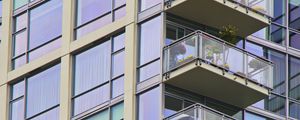 Preview wallpaper building, windows, balconies, flowers, plants