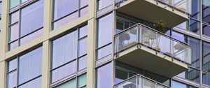 Preview wallpaper building, windows, balconies, flowers, plants