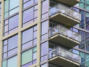 Preview wallpaper building, windows, balconies, flowers, plants