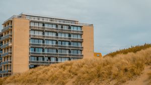 Preview wallpaper building, windows, balconies, grass, sky