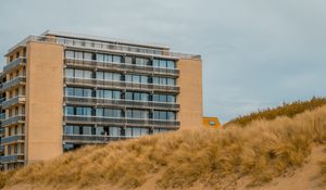 Preview wallpaper building, windows, balconies, grass, sky