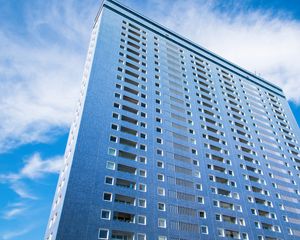 Preview wallpaper building, windows, sky, bottom view, blue