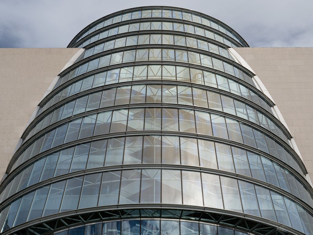 1024x768 Wallpaper building, windows, walls, clouds, city, architecture