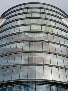 Preview wallpaper building, windows, walls, clouds, city, architecture