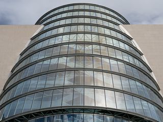 320x240 Wallpaper building, windows, walls, clouds, city, architecture