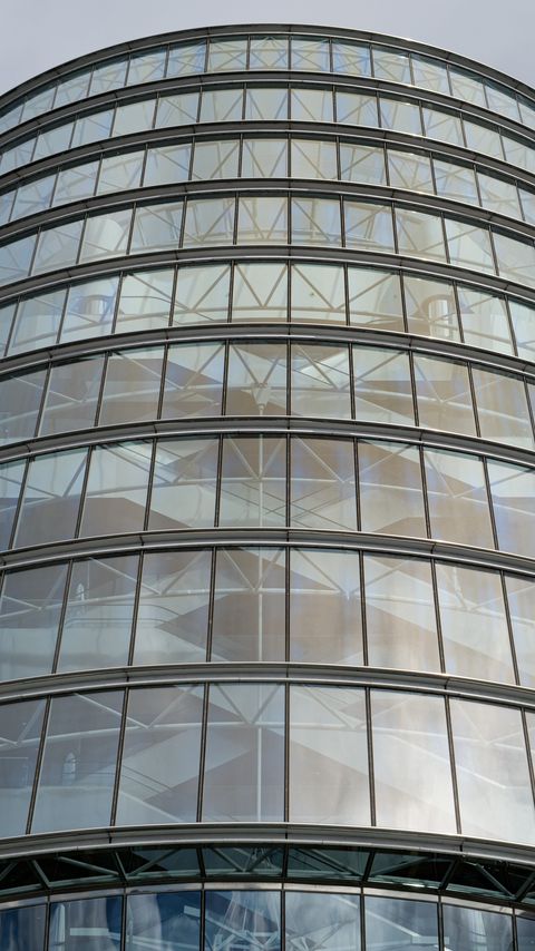 480x854 Wallpaper building, windows, walls, clouds, city, architecture