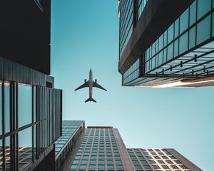 Preview wallpaper buildings, airplane, skyscrapers, sky