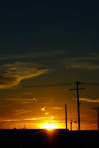 Preview wallpaper buildings, antennas, sun, sunset, clouds, sky, dark