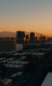 Preview wallpaper buildings, architecture, city, road, sunset, evening