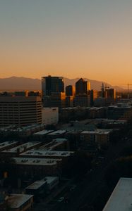 Preview wallpaper buildings, architecture, city, road, sunset, evening