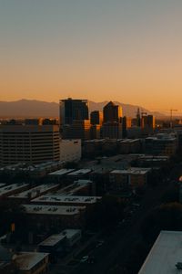 Preview wallpaper buildings, architecture, city, road, sunset, evening