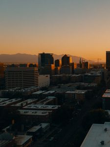 Preview wallpaper buildings, architecture, city, road, sunset, evening