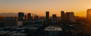 Preview wallpaper buildings, architecture, city, road, sunset, evening
