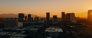Preview wallpaper buildings, architecture, city, road, sunset, evening