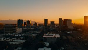 Preview wallpaper buildings, architecture, city, road, sunset, evening