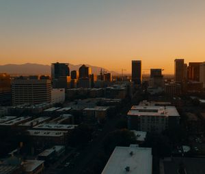 Preview wallpaper buildings, architecture, city, road, sunset, evening