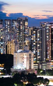 Preview wallpaper buildings, architecture, city, sunset, evening, lights