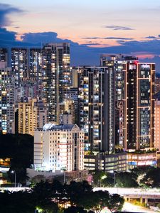 Preview wallpaper buildings, architecture, city, sunset, evening, lights