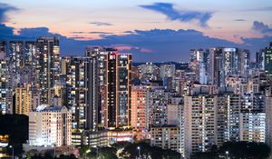 Preview wallpaper buildings, architecture, city, sunset, evening, lights
