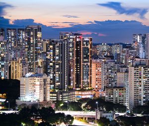 Preview wallpaper buildings, architecture, city, sunset, evening, lights
