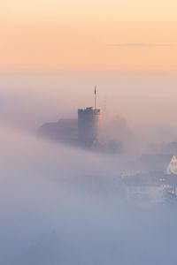 Preview wallpaper buildings, architecture, fog, clouds