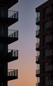 Preview wallpaper buildings, balconies, sunset, sky