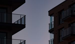 Preview wallpaper buildings, balconies, sunset, sky