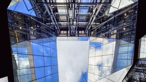 Preview wallpaper buildings, bottom view, mirror, sky, clouds, architecture