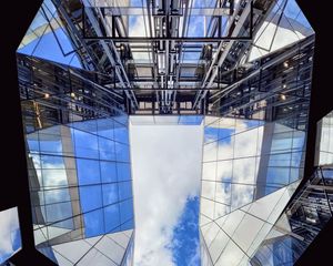 Preview wallpaper buildings, bottom view, mirror, sky, clouds, architecture